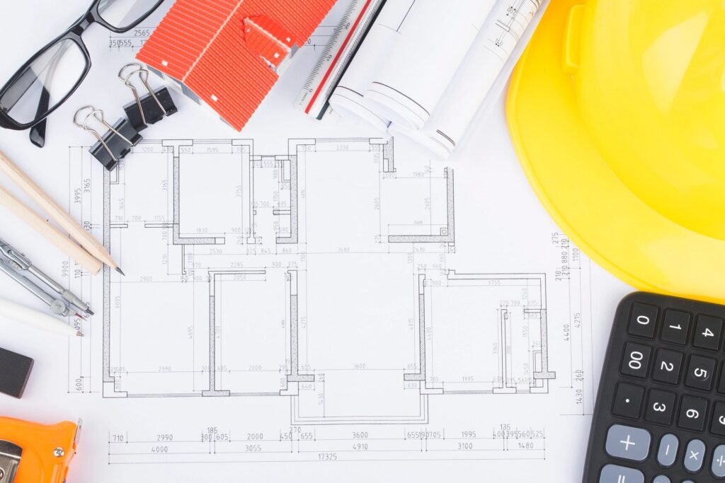 Construction planning with construction drawings and accessories,construction projects on paper. The concept of architecture,